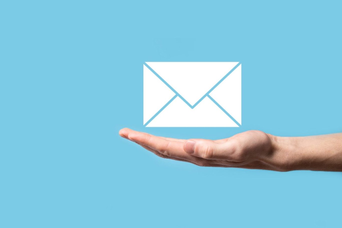 Hand holding an envelope icon on a light blue background.