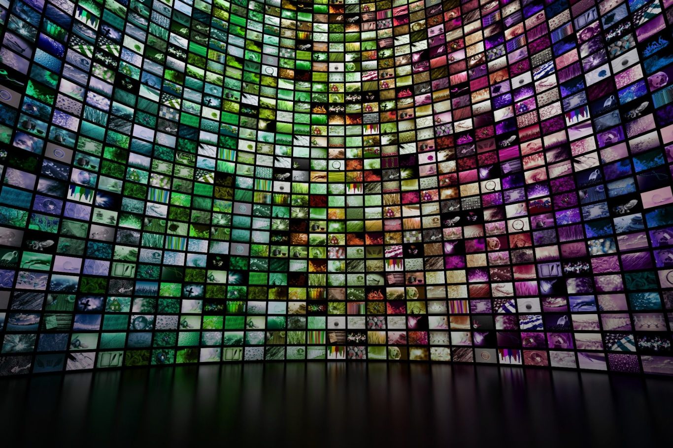 A wall of colorful screens displaying various digital content.