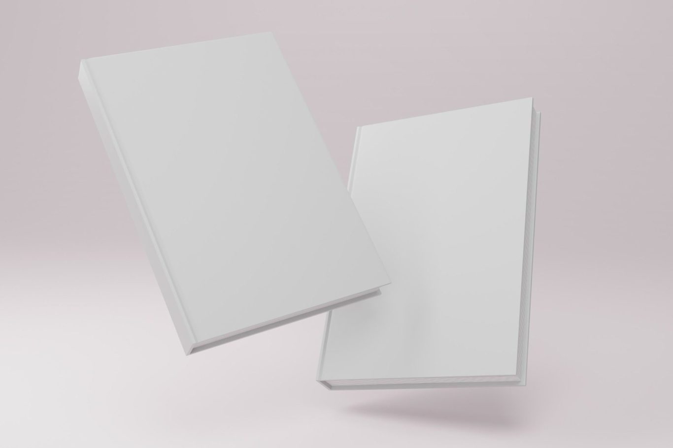 Two blank white books overlapping against a light background.