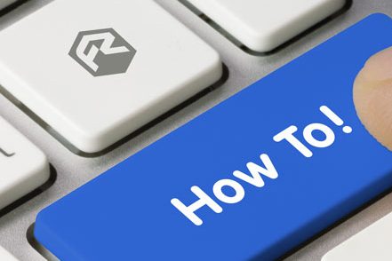 Close-up of a computer keyboard with a blue key labeled "How To!" being pressed.